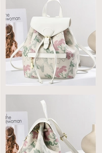 Detailed view of vintage floral jacquard backpack with leather buckle and gold hardware