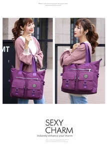 Detail of purple waterproof nylon tote bag with functional pockets and buckle straps