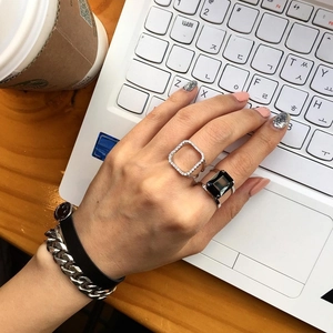 S925 sterling silver square ring and black gemstone ring set on modern desk setting