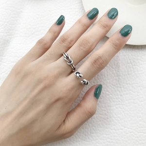 Adjustable S925 sterling silver knotted ring with vintage finish on finger