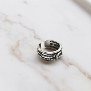 Vintage S925 sterling silver open ring with twisted rope texture on marble background