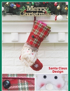Detail of red plaid Christmas stocking with 3D Santa Claus face and snowflake embroidery