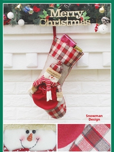 Close-up of linen Christmas stocking featuring a 3D snowman with red checkered hat