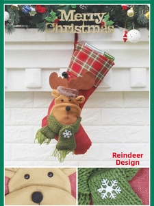 Detail of Christmas stocking with 3D reindeer design hung on a festive white fireplace