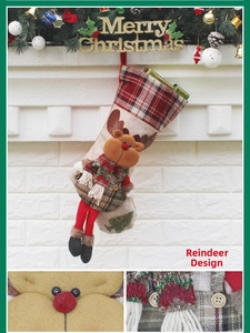 Detail of 3D reindeer Christmas stocking with red plaid scarf and burlap texture