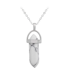 Macro detail of hexagonal white turquoise crystal point pendant on silver chain necklace