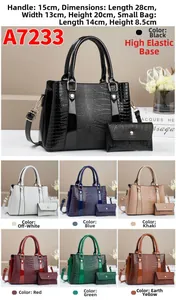 Detail view of stylish two-piece handbag set featuring crocodile pattern embossed faux leather