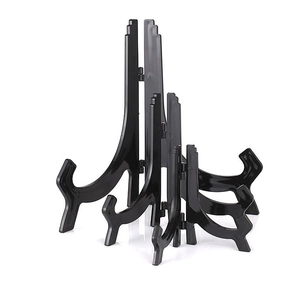 Three versatile black plastic display stands in different sizes for plates and frames