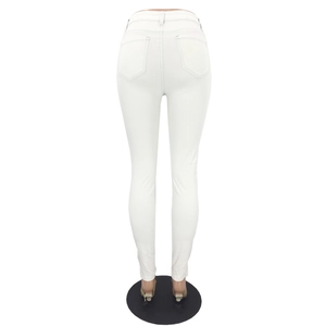 Close-up of white high-waisted skinny jeans featuring rear pockets and slim-fit tailoring