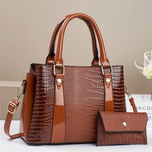 Brown crocodile embossed leather tote bag set with matching small zipper wallet and gold hardware