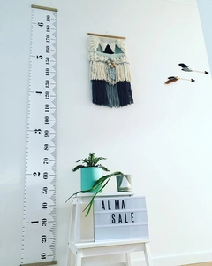 Detail of Nordic canvas height chart featuring precise dual scales in cm and feet