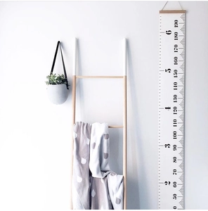 Detail of Nordic canvas height chart hanging on wall with 50-190cm printed scale