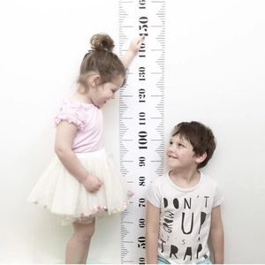 Detail of Nordic kids height chart on canvas showing two children measuring their height
