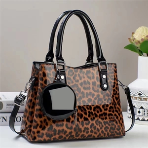 Leopard print glossy faux leather handbag set with matching round coin purse and handles