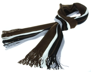 Detail of striped knitted winter scarf with tassels in brown, black, and grey tones