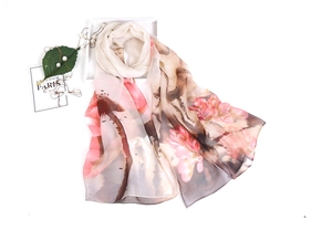 Detailed view of long pink lotus floral silk scarf with elegant gray ink wash pattern
