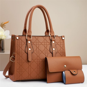 Three-piece brown shoulder bag set with quilted pattern and metal stud details