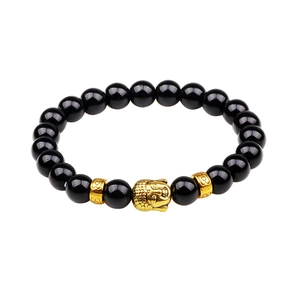 8mm black lava stone bead bracelet with a golden Buddha head charm on white background