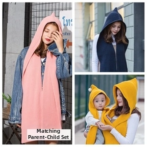 Detail of knitted hooded scarf set for parents and kids in multiple colors