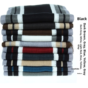 Detailed view of ten color options for thick striped knit scarves with fringe details