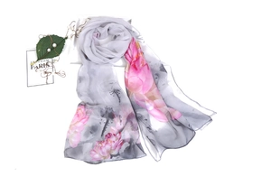 Detail of sheer summer long scarf featuring elegant lotus ink print on grey fabric