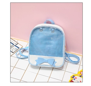 Detailed view of ita bag with a clear PVC window and decorative blue bow accent