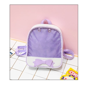 Detail of cute purple and white ita bag with clear window and bow decoration