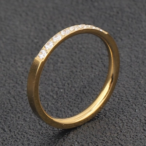 Detailed close-up of 18K gold-plated stainless steel ring featuring a half-row of zircons