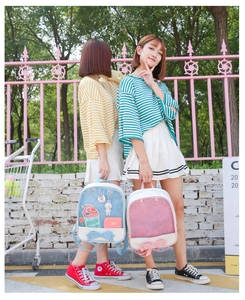 Outdoor shot of blue and pink Japanese style ita bags with transparent PVC and bow details