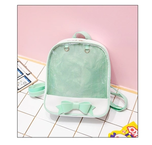 Close-up of mint green bow and glitter transparent window on the PU leather backpack