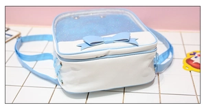 Detailed view of the clear PVC display window and blue bow on a white Japanese ita bag