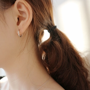 Minimalist S925 sterling silver geometric hoop earrings on model for a refined look