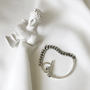 925 sterling silver chain bracelet with OT toggle clasp on white fabric background