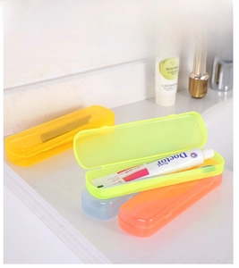 Macro view of portable travel toothbrush storage cases in four vibrant colors