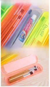 Macro shot of colorful transparent travel case for toothbrushes and makeup brushes