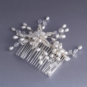 Elegant bridal pearl hair comb with sparkling rhinestones and silver wire floral details