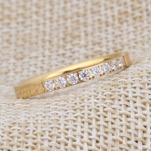 Polished 18K gold plated stainless steel 2mm ring featuring sparkling cubic zirconia