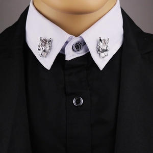 Silver wolf head collar clips with long chain tassels on white shirt and black blazer