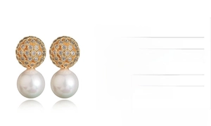 Detail showing S925 silver needle pearl earrings with micro-inlaid zircon and gold finish