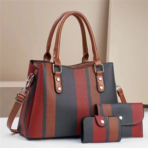 Three-piece striped canvas handbag set with tote, wallet and pouch in a vertical pattern