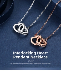 Close-up of interlocking heart necklace in S925 sterling silver with rose gold finish