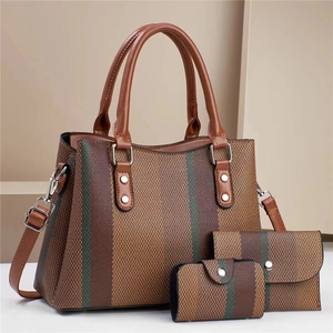 Three-piece brown canvas tote bag set with contrast stripes and leather handles