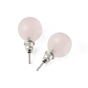 Macro view of 10mm round pink quartz stone stud earrings with silver metal backings