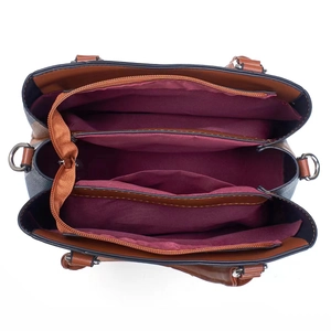 Top view of contrast canvas tote bag showing organized multi-layer interior compartments