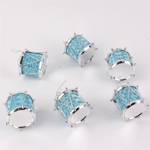 Detail of light blue and silver mini Christmas drum ornaments with glitter finish