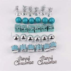 Detailed flat lay of 32pcs lake blue and silver Christmas tree ornaments and bells