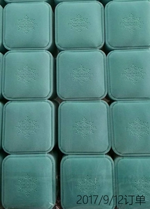 Detailed grid of mint green velvet jewelry boxes featuring embossed snowflake logos