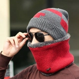 Detail of red and grey knit beanie set with thick plush lining for winter warmth