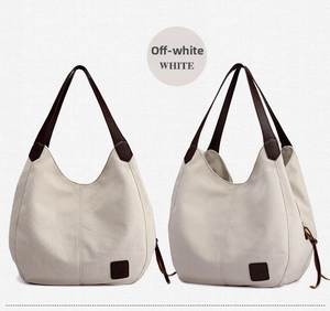 Front and side view of beige canvas shoulder bag with brown leather straps