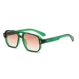 Retro double bridge square sunglasses with green frames and gradient lenses from a 45-degree angle